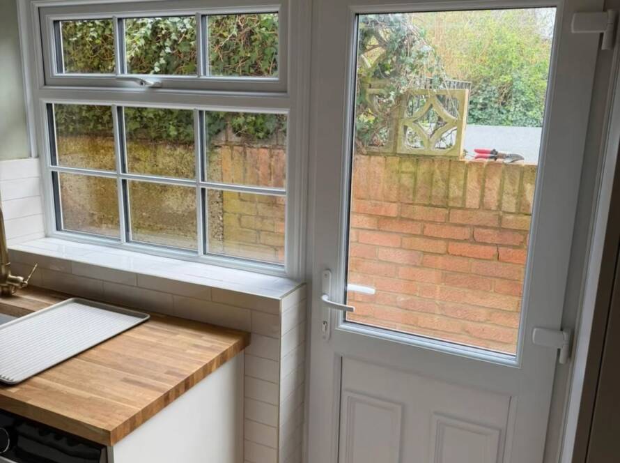 Modern charcoal grey uPVC window installation in a Hereford residential property showing clean FENSA-compliant finish.
