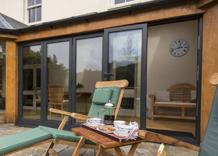 FENSA installers fitting bespoke French doors in a Bedford home.