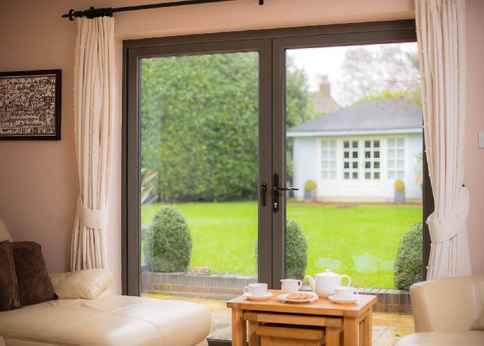 Energy-efficient French doors installed in a Bedfordshire garden room.