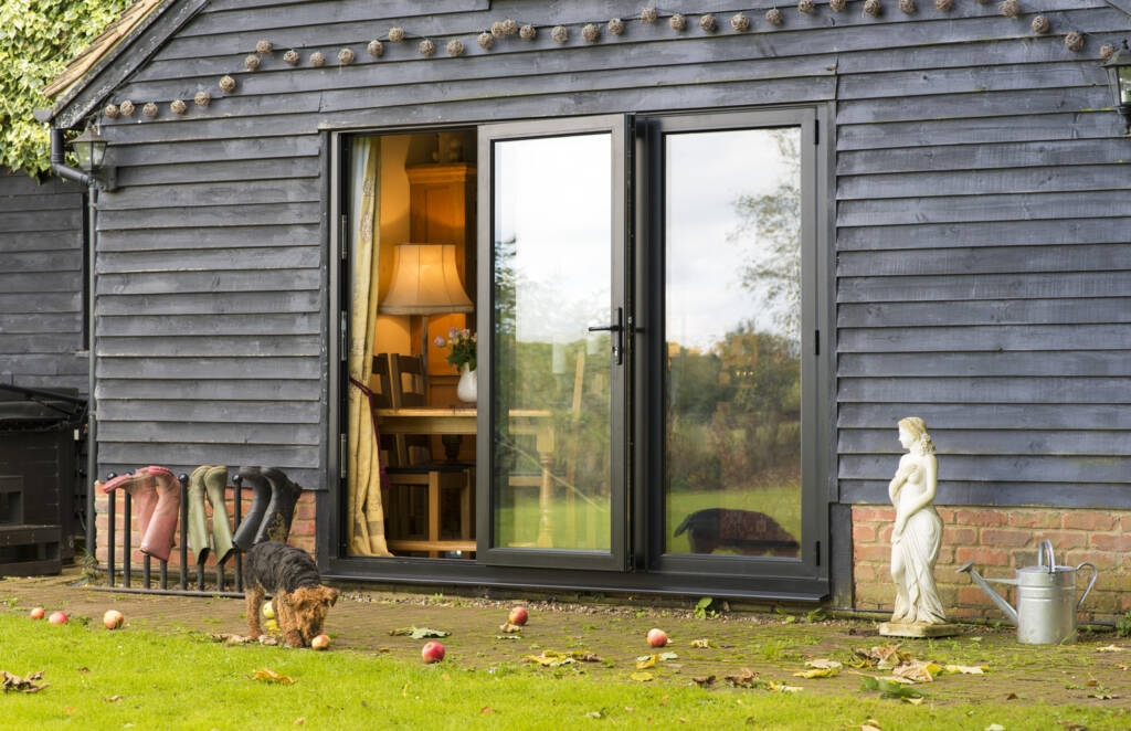 Bi-fold doors maintenance cleaning aluminium door tracks in UK home