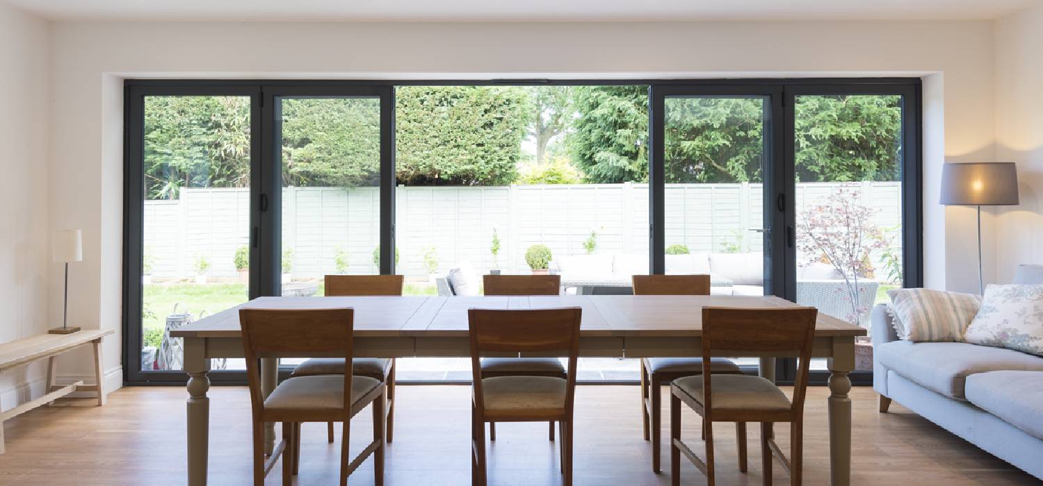 Bi-fold window repair service with new uPVC frame replacement and fitting