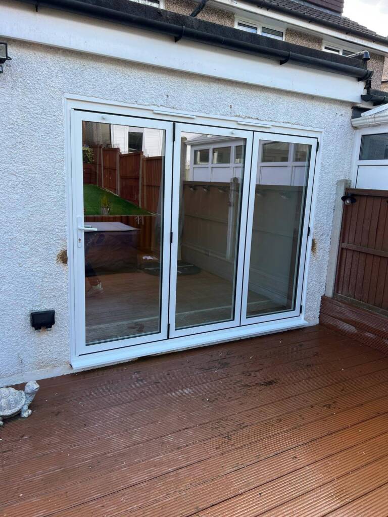 Bi-fold doors maintenance cleaning aluminium door tracks in UK home