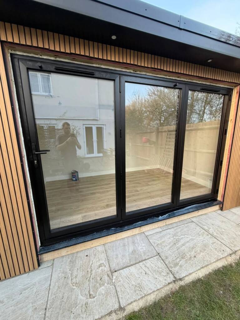 Aluminium bifold door installation in garden room Hitchin property
